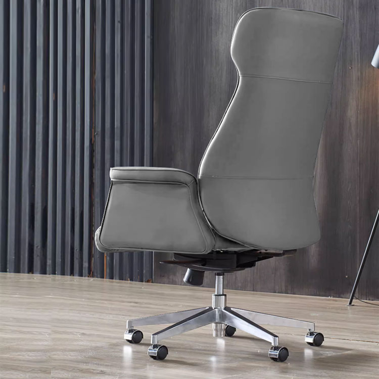 White leather office desk chair in a modern executive interior